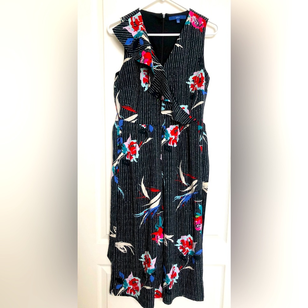 Woman’s sleeveless black flowered pants jumper w/ zipper and tie waist